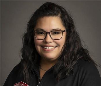 female servpro employee in front of blank background